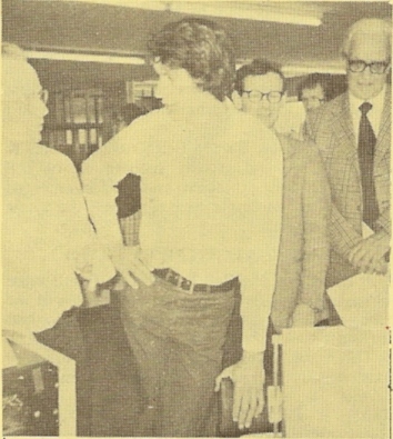 An interested ringer listening to explanations of computer checking give by (left) Peter Rowe (Farnham). Standing at the rear are Peter Wilkinson and John Freeman