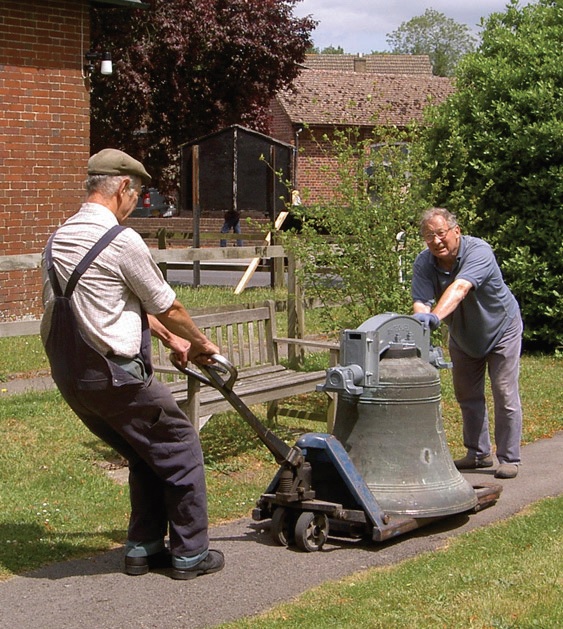 Two men with bell